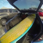 Getting my longboard surfboard out of my car